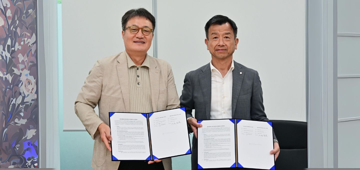 A couple of men holding papers